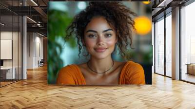  Inclusive image of happy blasian woman working on computer in creative agency office workplace. Young successful mixed race female businesswoman talking on client video call team meeting Wall mural