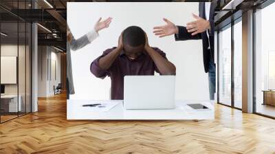 Angry overwhelmed african businessman frustrated with discrimination at work, hates stressful job, feels headache or closing ears to avoid annoying people noise, nervous breakdown or burnout concept Wall mural