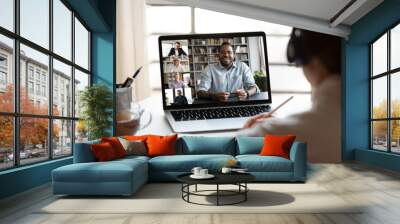 back view of female employee have webcam conference on computer with multiracial colleagues, woman t Wall mural