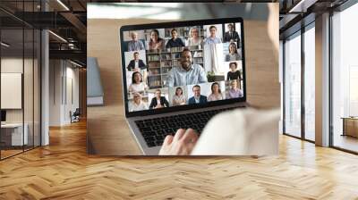 Back view of female employee speak talk on video call with diverse multiracial colleagues on online briefing, woman worker have Webcam group conference with coworkers on modern laptop at home Wall mural