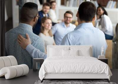 Boss introducing black new worker to workmates Wall mural