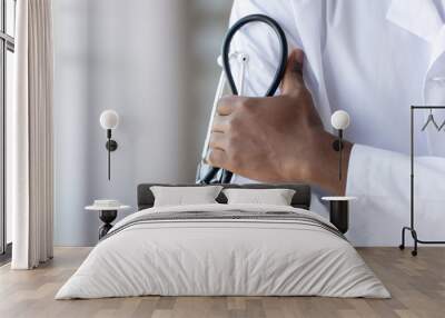 Close up african american young male doctors hands, holding phonendoscope. Wall mural