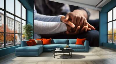 Close up black woman and man in love sitting on couch two people holding hands. Symbol sign sincere feelings, compassion, loved one, say sorry. Reliable person, trusted friend, true friendship concept Wall mural