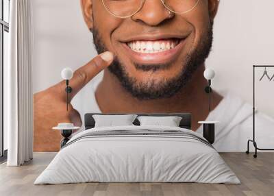 Close up of biracial man show white healthy teeth Wall mural