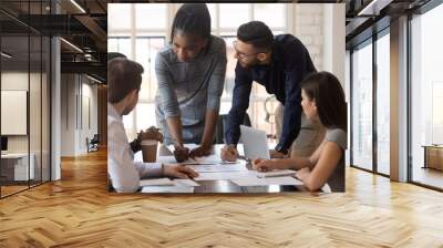 Diverse group of managers working together at office. Wall mural