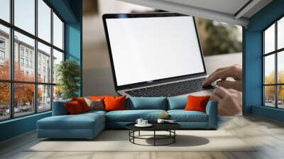 Empty white laptop display on work table of mature business freelance woman. Cropped shot of senior customer lady typing on computer with copy space on blank screen. Cropped close up shot Wall mural