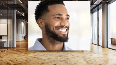 Face of happy attractive young African American man looking away with perfect toothy smile, thinking, promoting dental care, stomatology service. Cheerful handsome Black guy close up portrait Wall mural