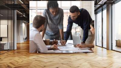 Focused multiracial corporate business team people brainstorm on paperwork Wall mural