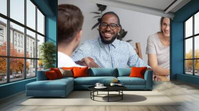 Happy african hr recruit handshake hire candidate at job interview Wall mural