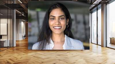 Happy beautiful Indian manager girl head shot video conference screen portrait. Positive young woman keeping in white casual office jacket looking at camera with toothy smile, laughing Wall mural