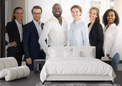 Happy diverse and multiracial employees group looking at camera. Wall mural