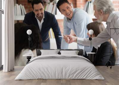 Happy diverse business team talking gather at conference table Wall mural