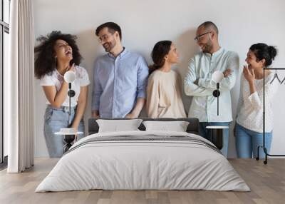 Happy diverse people having fun, talking, standing in row Wall mural