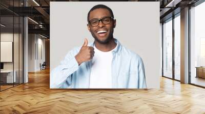 head shot happy excited african american man showing thumbs up Wall mural