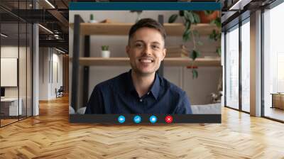 Head shot portrait screen view happy man using webcam and social media app, chatting with friends or relatives, participating in online conference, making video call, studying or working online Wall mural