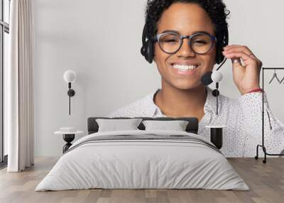 Head shot portrait smiling African American female, support service operator Wall mural