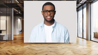 Headshot of african American male in glasses posing in studio Wall mural