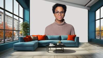 Headshot of black woman in glasses posing isolated in studio Wall mural