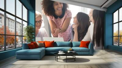 International company diverse members working together laughing having fun Wall mural