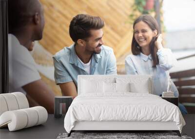 Multicultural happy people laughing talking at reunion meeting on terrace Wall mural