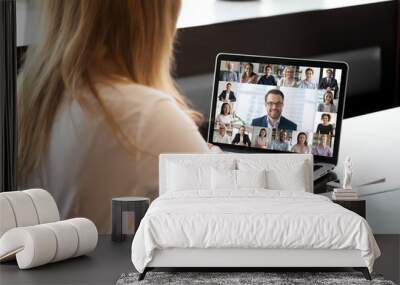 Pc screen view over woman shoulder at group video call. Visual communication between engaged diverse people distantly using webcam and laptop internet connection app. International remote chat concept Wall mural