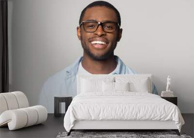 Portrait of smiling black man in glasses isolated in studio Wall mural