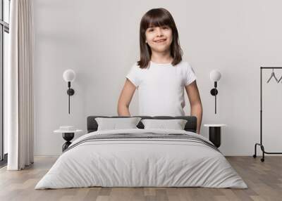 Portrait of smiling fringe hair styled little cutie. Wall mural