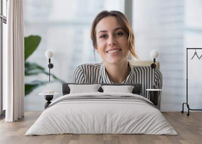 Smiling businesswoman looking at camera webcam make conference business call Wall mural