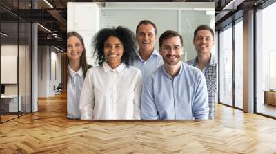 Smiling diverse office workers group, happy multiracial professional members employees looking at camera, motivated staff business people posing together, multi-ethnic workforce sales team portrait Wall mural