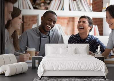 Smiling multiracial young people have fun studying together Wall mural