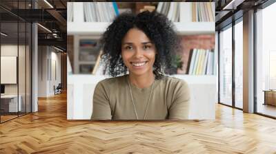 Smiling young african american woman looking at camera webcam  Wall mural