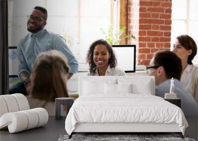 Staff of international company sitting in office during business seminar Wall mural