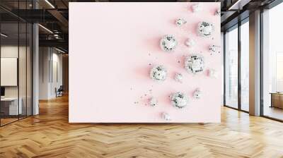 Christmas composition. Silver disco balls on pastel pink background. Christmas, winter, new year concept. Flat lay, top view, copy space Wall mural