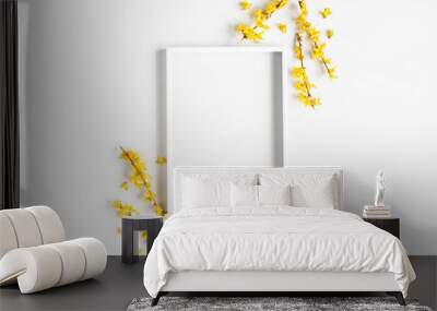 Flowers composition. Photo frame, yellow flowers on white background. Spring concept. Flat lay, top view Wall mural