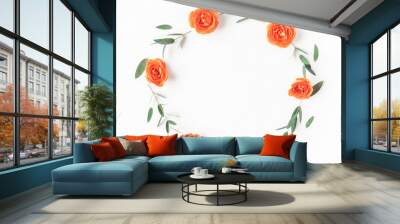 Flowers composition. Wreath made of orange rose flowers and eucalyptus leaves on white background. Flat lay, top view Wall mural