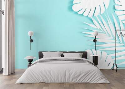 Summer composition. White palm leaves on blue background. Summer concept. Flat lay, top view, copy space Wall mural