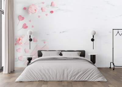 Valentine's Day background. Pink flowers, envelope, hearts on marble background. Valentines day concept. Flat lay, top view Wall mural