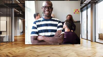 african designer smiling confidently after an office meeting Wall mural