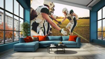 American football player low fiving his teammates after a game Wall mural