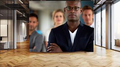 Black male executive with arms crossed facing camera Wall mural