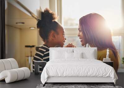 black woman and little daughter smiling Wall mural