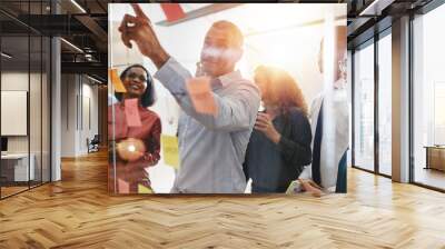 Businesspeople brainstorming together with sticky notes in an of Wall mural