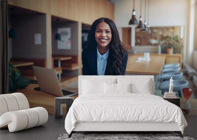 Confident young African American businesswoman working in an off Wall mural