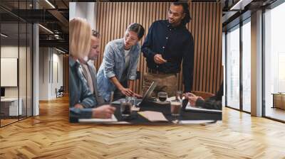 Diverse businesspeople having a meeting in an office boardroom Wall mural