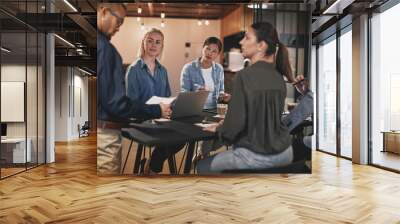 Diverse businesspeople listening to a presentation in an office Wall mural