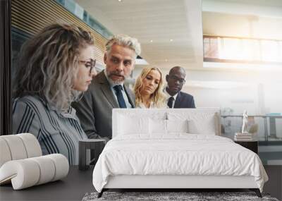 Diverse group of coworkers talking business together in an office Wall mural