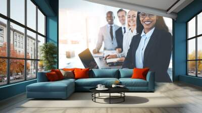 Diverse group of smiling businesspeople standing in a bright off Wall mural