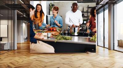 Friends cooking dinner together Wall mural