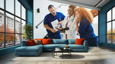 Group of diverse medical professionals talking together in a hos Wall mural