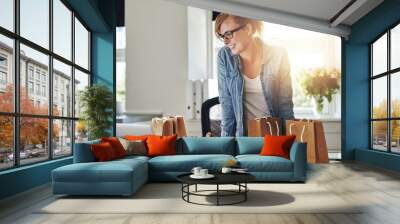 Happy businesswoman working in a home office Wall mural